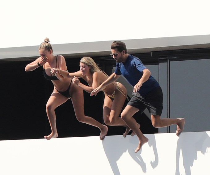 Scott Disick and Sofia Richie jump into the water