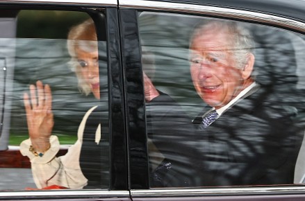 TOPSHOT - Britain's King Charles III and Britain's Queen Camilla wave as they leave by car from Clarence House in London on February 6, 2024. King Charles III's estranged son Prince Harry reportedly arrived in London on Tuesday after his father's diagnosis of cancer, which doctors "caught early". (Photo by HENRY NICHOLLS / AFP) (Photo by HENRY NICHOLLS/AFP via Getty Images)